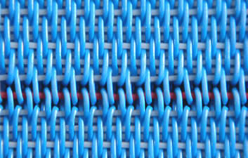 Two blue belts are joined together by slipping a red pin through SWRS-2 single warp-ring seams.